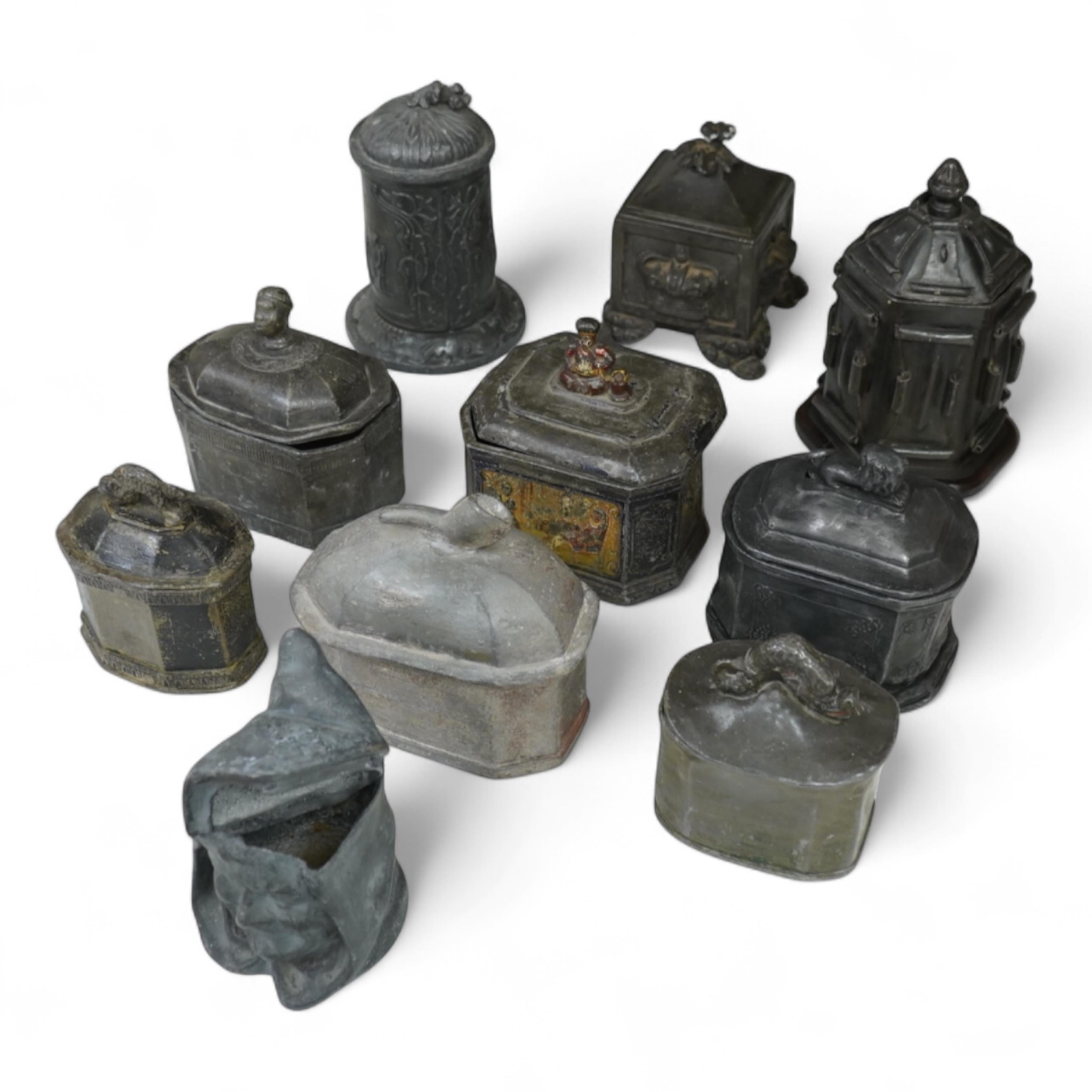 A collection of ten early 19th century lead tobacco boxes to include an octagonal example with remains of paintwork, largest 19cm high
